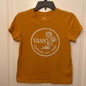 Vans t-shirt.  Juniors small.  Orangish color with white writing.